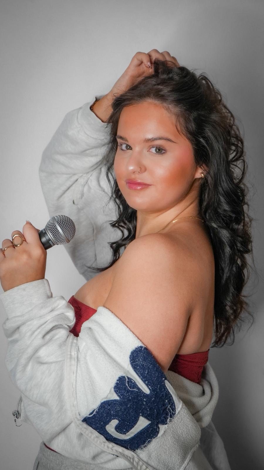 Molly Imogen holding a microphone